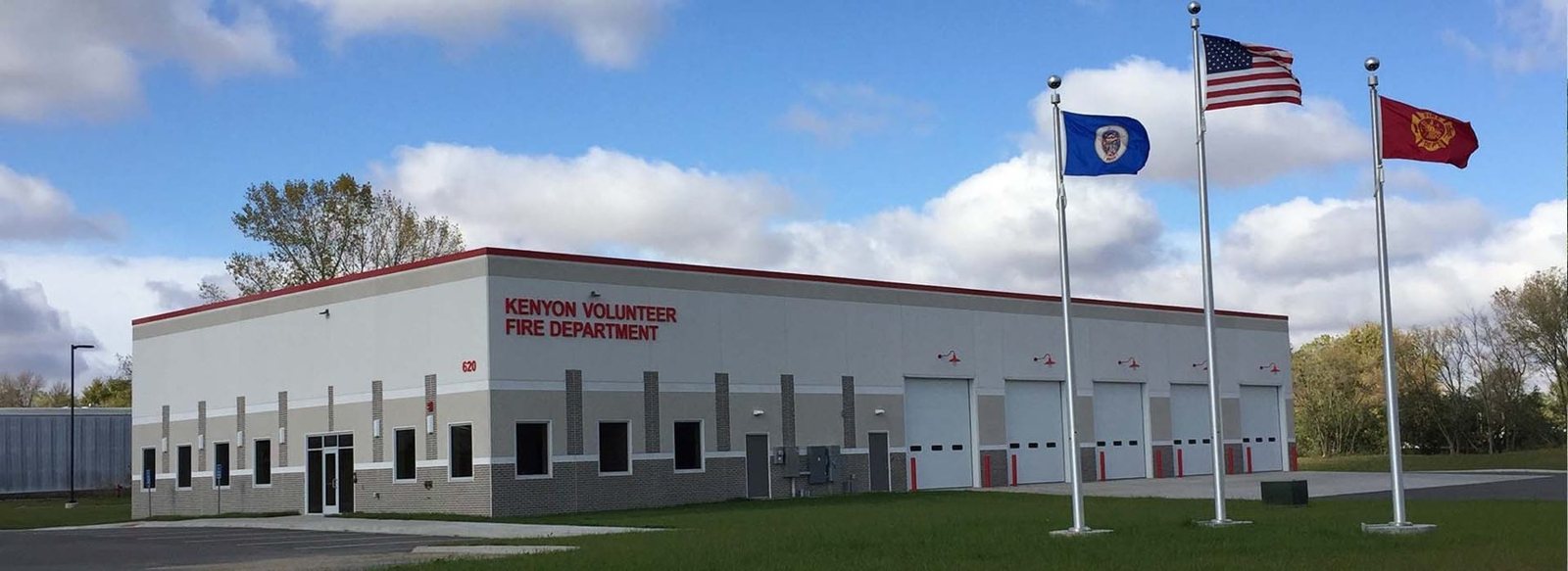 Kenyon Volunteer Fire Department station with three flags flying