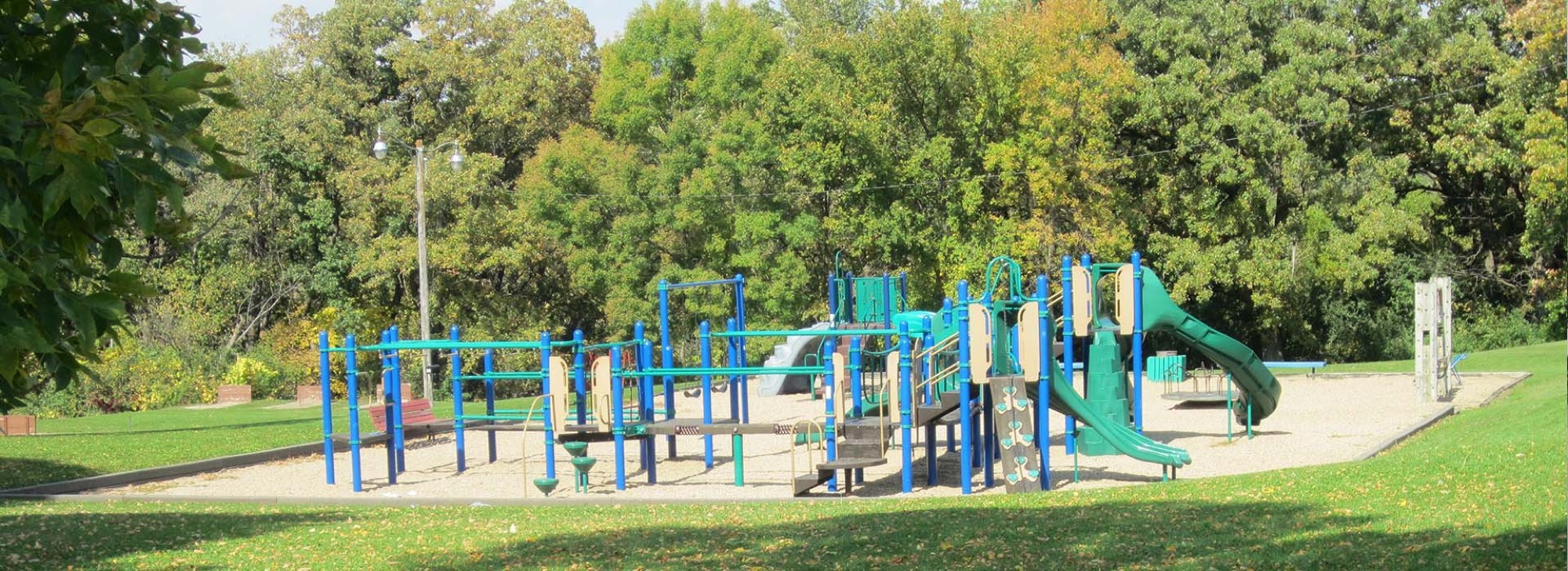 Playground at Depot Park under oaks turning yellow in early fall